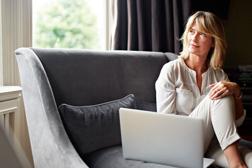 older woman enjoying a mindfulness meditation session online
